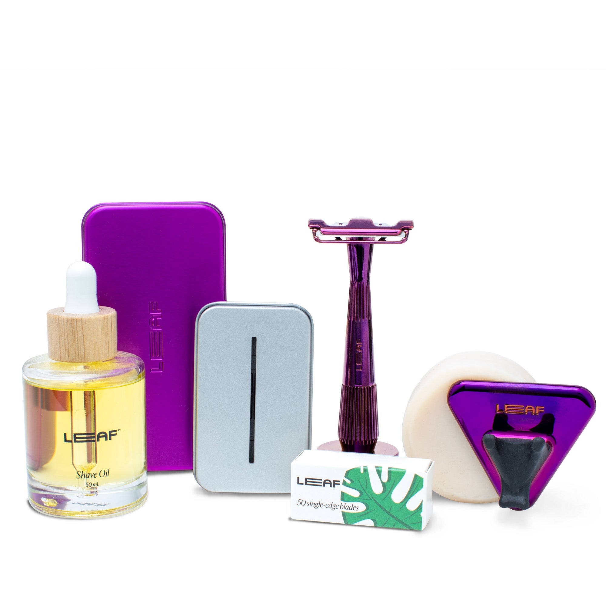 A fig-finish Everything Bundle for single-edge razors, from left-to-right: Shave Oil, Case, Recycling Tin, Razor and Stand, Blade box, shave Soap, Shower Holder