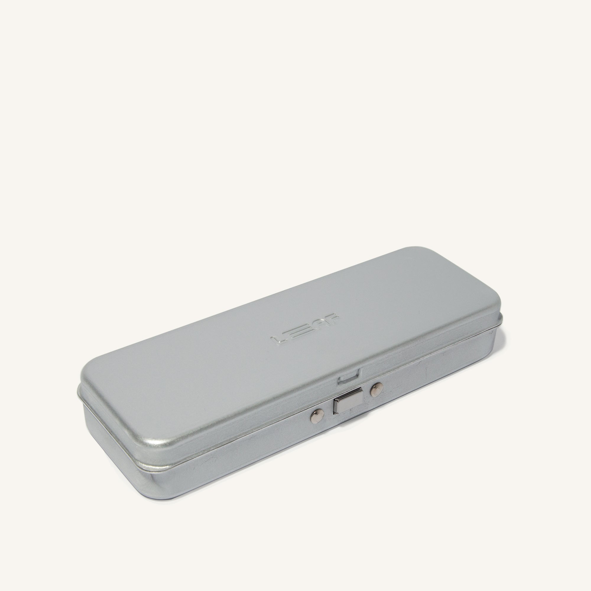 Silver metal case, closed.