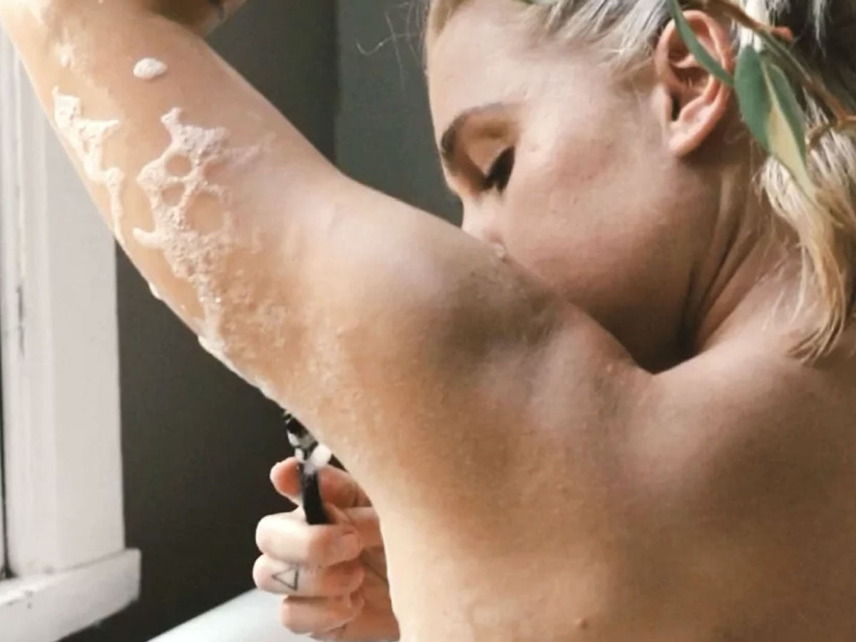 women shaving under her arms