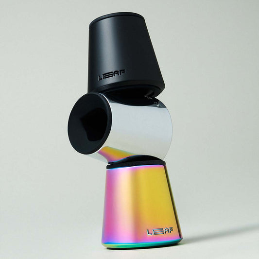 Multicolored razor stand, three stacked on top of eachother, with 'LEAF' branding on a light gray background