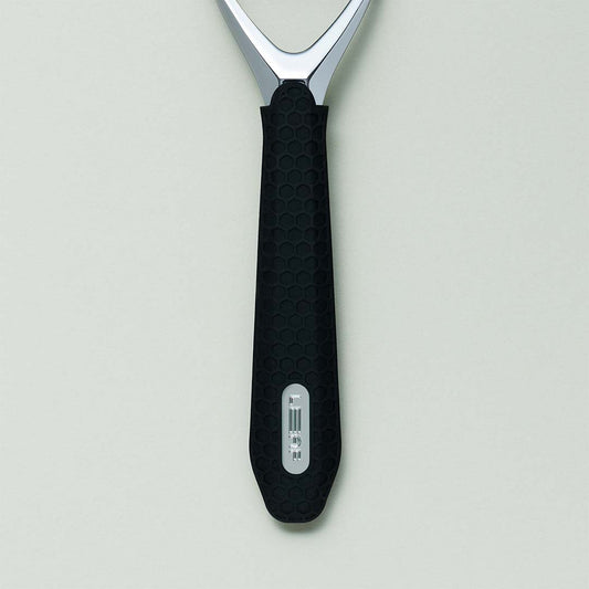 Spatula with black handle and silver head on a light gray background