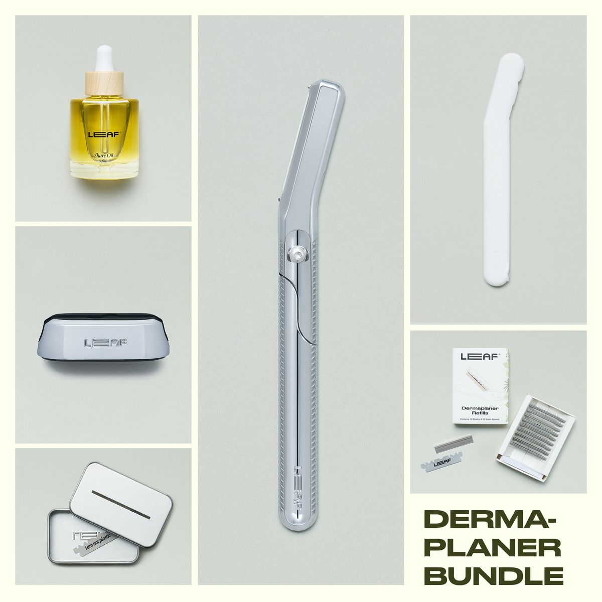 Leaf Shave Dermaplaner bundle in chrome finish including handle, refill blades packaging, stand, white travel cover, recycling tin, and glass shave oil bottle on grey background