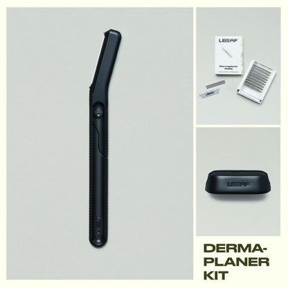 Leaf Shave Dermaplaner kit in black finish including handle, refill blades packaging, and stand on grey background