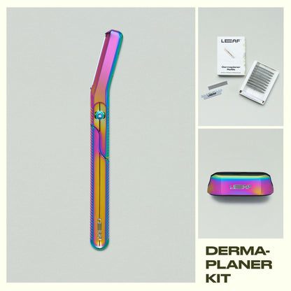 Leaf Shave Dermaplaner kit in prism finish including handle, refill blades packaging, and stand on grey background