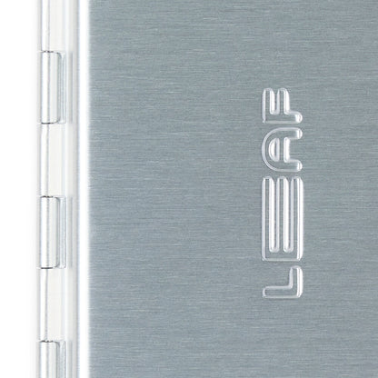 A closed silver single edge razor case closeup