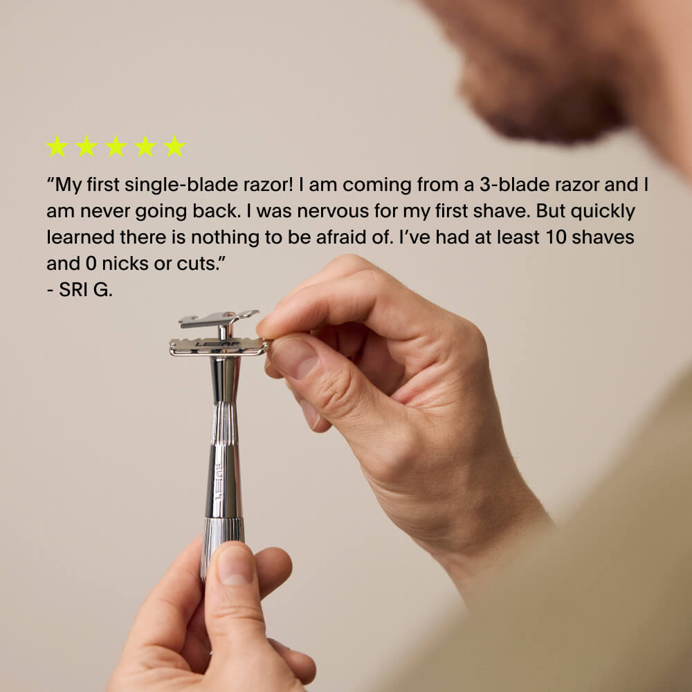 A 5 star review of the single edge razor over a user adjusting the blade of it