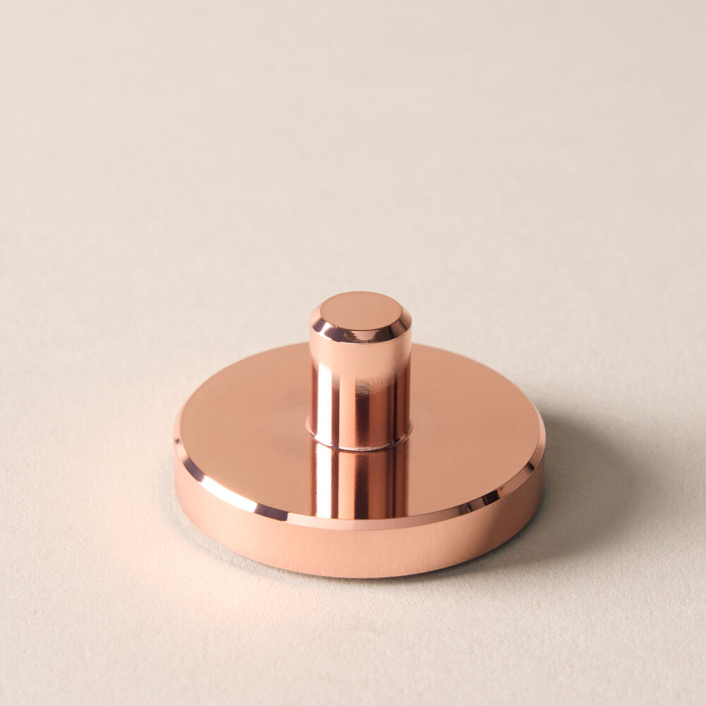 A rose gold single edge razor stand