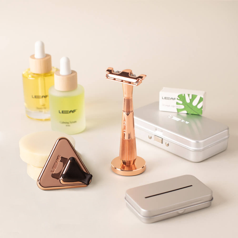 The rose gold single edge everything bundle with the single edge razor, stand, blades, case, recycling tin, shave oil, calming serum, shave soap bar, and shower holder