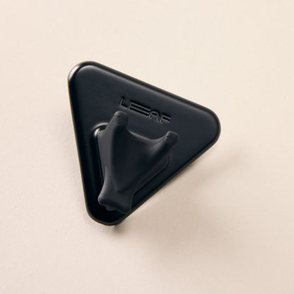 A black razor shower holder 