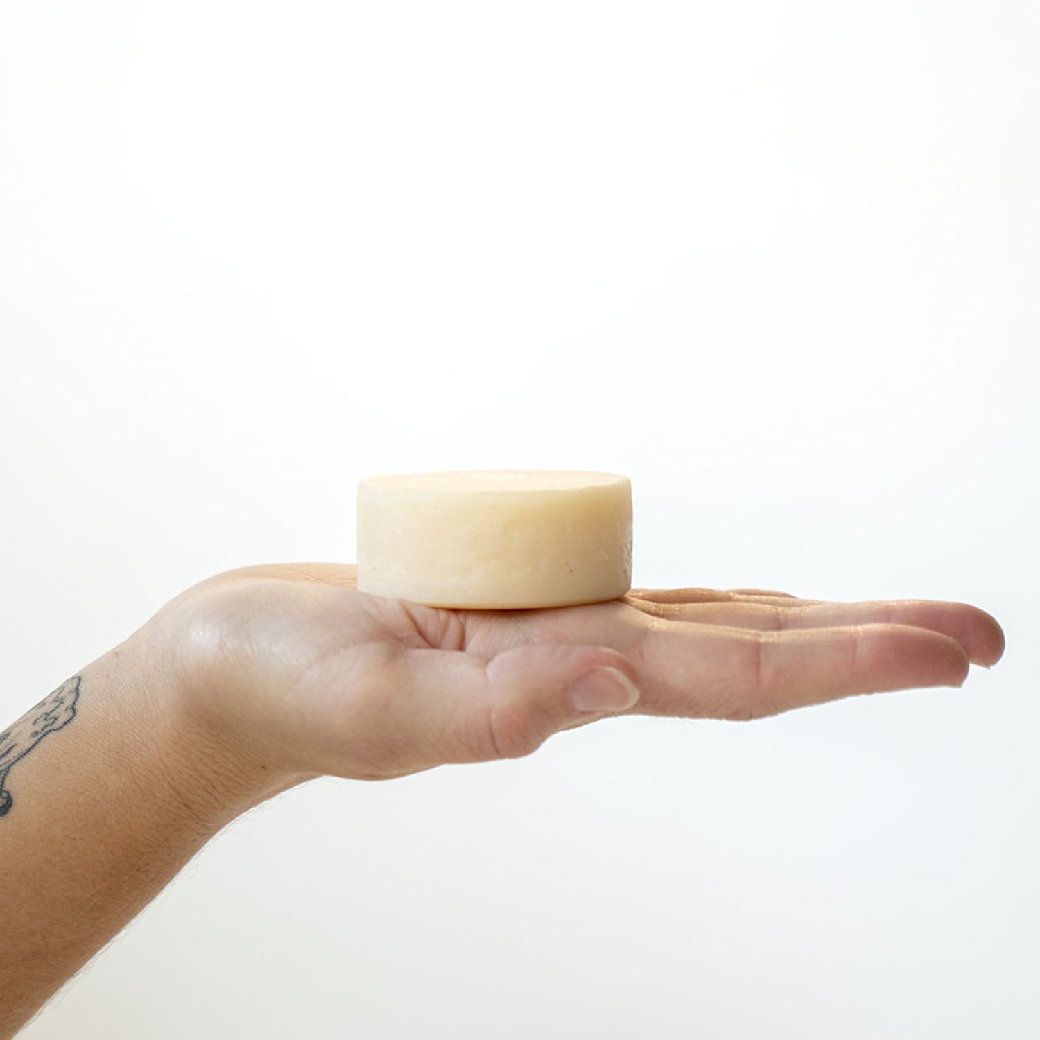 Shave Soap Bar in the palm of an outstretched hand